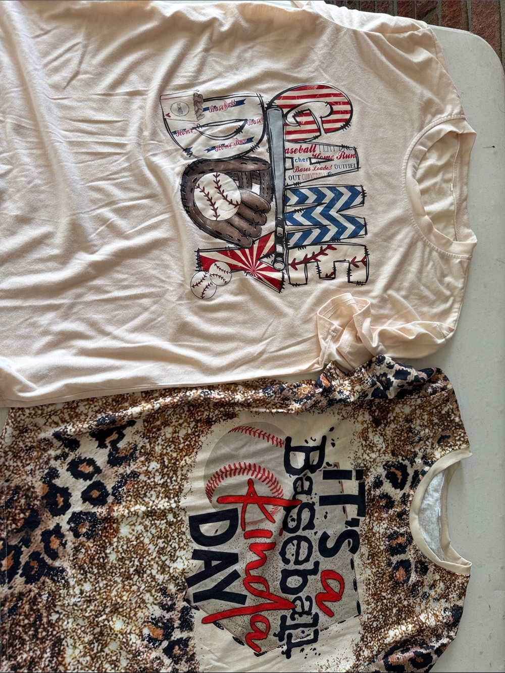 SHEIN Cream Graphic Baseball Tee with Red Blue and Brown Accents